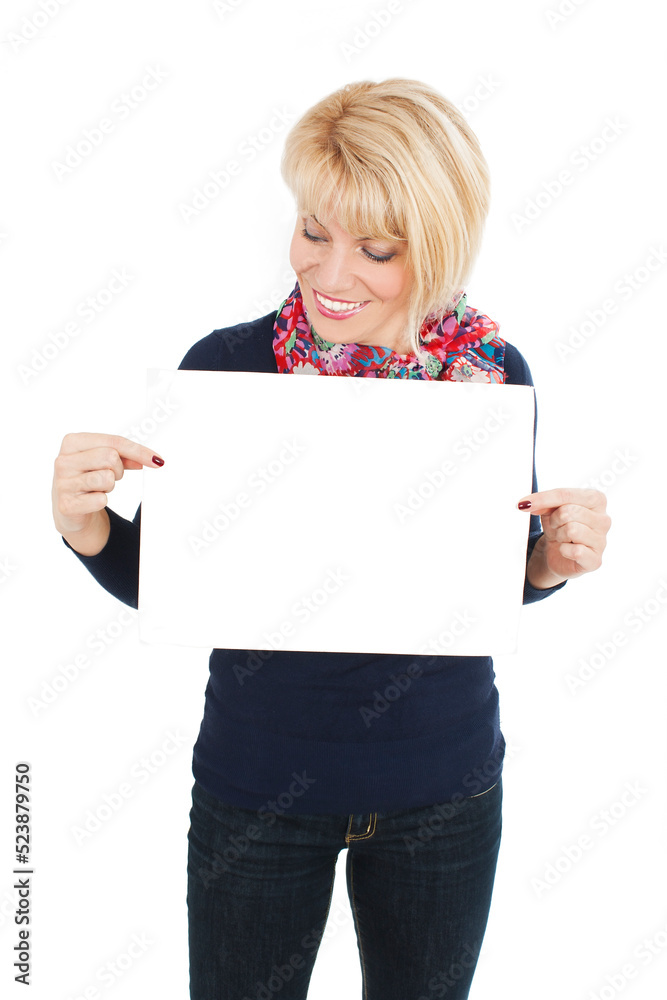 Smiling woman holding white sign board. Portrait of smiling young model with modern haircut. Isolated on white background. Studio shot Smiling woman holding white sign board. Portrait of smiling young model with modern haircut. Isolated on white background. Studio shot