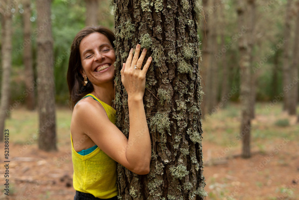 woman hugging a tree woman hugging a tree