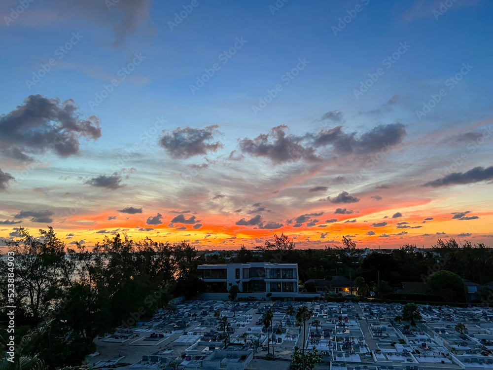 Obraz premium An aerial view of Cemetery Beach on Seven Mile Beach in Grand Cayman Island with a beautiful sunset.