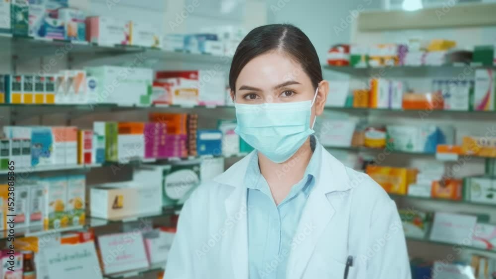 Portrait of female pharmacist wearing face mask in a modern pharmacy drugstore. Portrait of female pharmacist wearing face mask in a modern pharmacy drugstore.