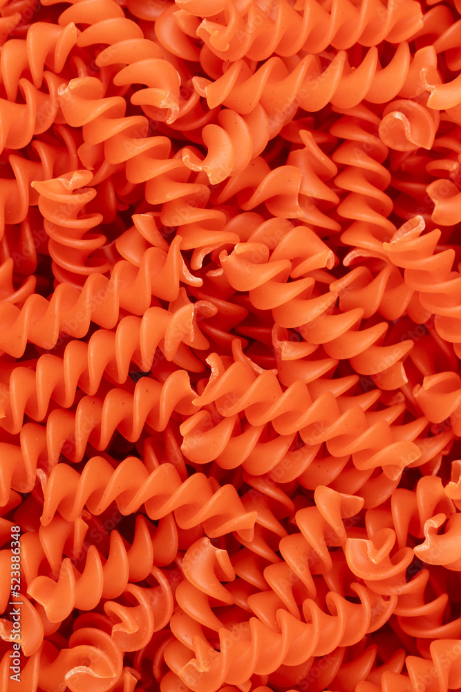 Fototapeta premium Whole, lentils fusilli pasta background.