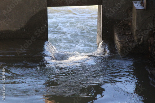 water gurgling through a brick wall photo