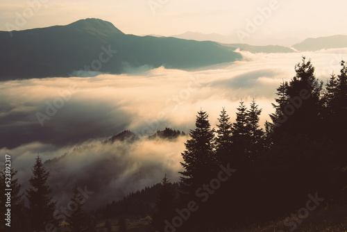 Dramatic sunset over clouds in Adjara region with clouds pass and sun over horizon .Stunning vibrant sunset background over clouds