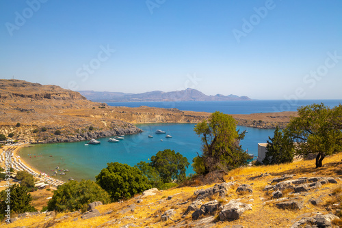 View of the Lindos beach and surrounding landscape of east cost Rhodes island near of Lindos town, Greece, Europe.