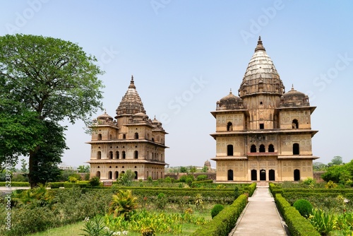 Beautiful shot of the Royal Chhatris of Orchha with a garden, India photo