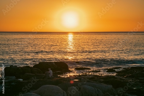 Bright golden sunset sky over Sea Point, Cape Town, South Africa