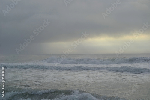 storm clouds over ocean water surface 