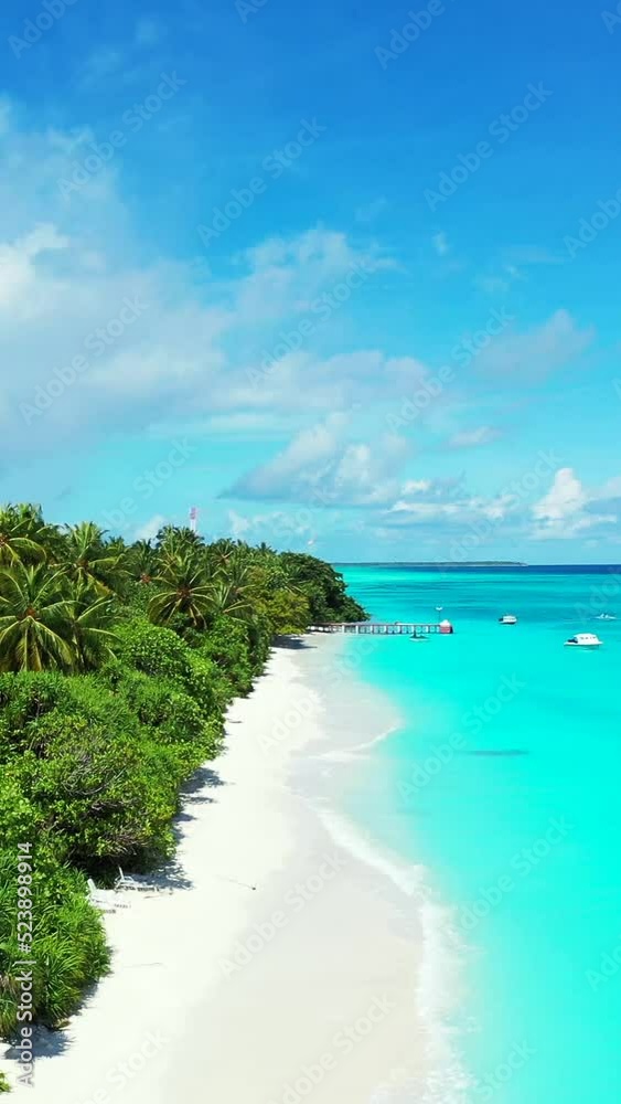 Aerial view of the seascape on the beach on a paradise island near Over Reef Sandbank Maldives