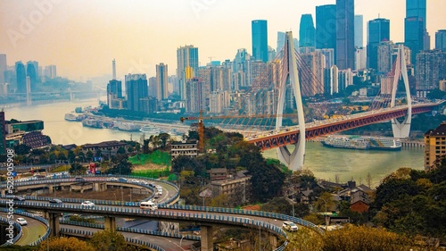 Aerial view of complex Twin River Bridges against a cityscape in Chongqing, China photo