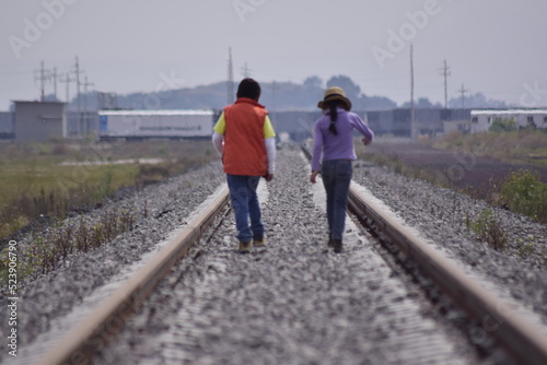 girl walks on the tracks 
