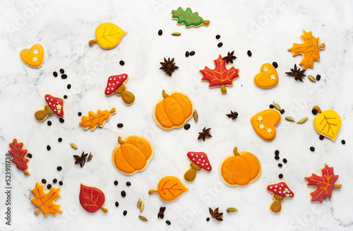Tasty cookies and sweets for Halloween party on white background. Flat lay