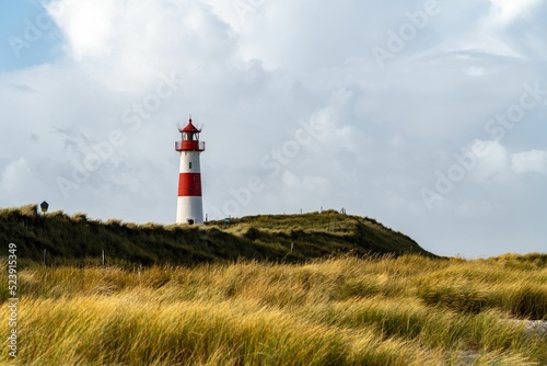 Beautiful shot of the historic Sylt lighthouse on a rural field in Hornum photo