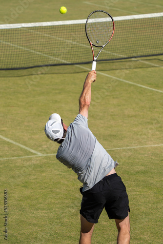  Amateur playing tennis at a tournament and match on grass in Melbourne, Australia   © William