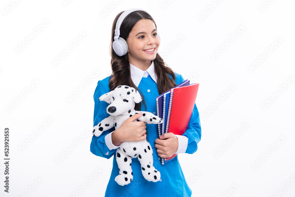 Back to school. Teenager schoolgirl hold toy. School children with favorite toys on isolated white studio background. Back to school. Teenager schoolgirl hold toy. School children with favorite toys on isolated white studio background.