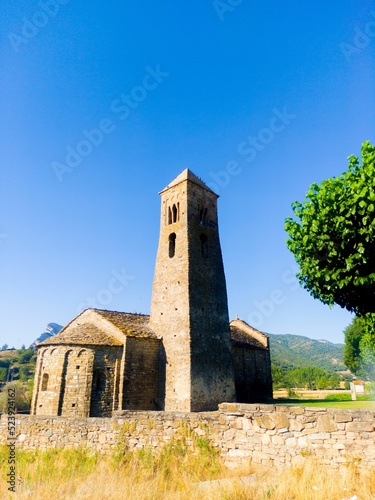 Old little church with a background of mountains photo