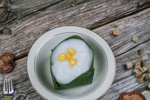 Thai Pudding with Coconut topping on banana leaf(Tako). Jelly coconut cream with corn and taro on top. Thai desert ,Famous