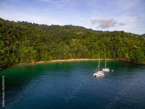 Yachts in Bay with Lonely Beach in the Caribbean. Trinidad and Tobago photo