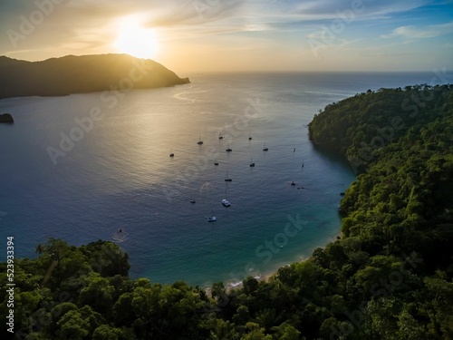 Sunset over Caribbean Bay with Yacht Tourists Anchoring photo