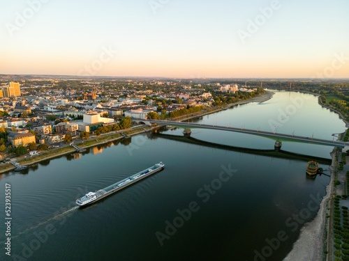 Fotobehang Beautiful view of Bonn cityscape with a barge and Kennedybrucke on the Rhine at