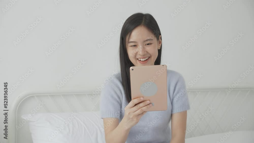 Young asian woman using digital tablet computer for video conference online with friends, businesswoman working with video call for meeting with social network, business and communication concept. Young asian woman using digital tablet computer for video conference online with friends, businesswoman working with video call for meeting with social network, business and communication concept.