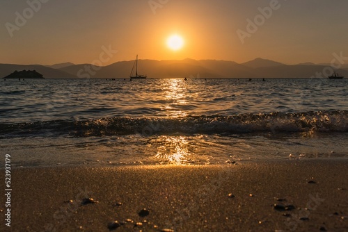 Beautiful golden sunset sky over the seashore in Argolis, Greece photo