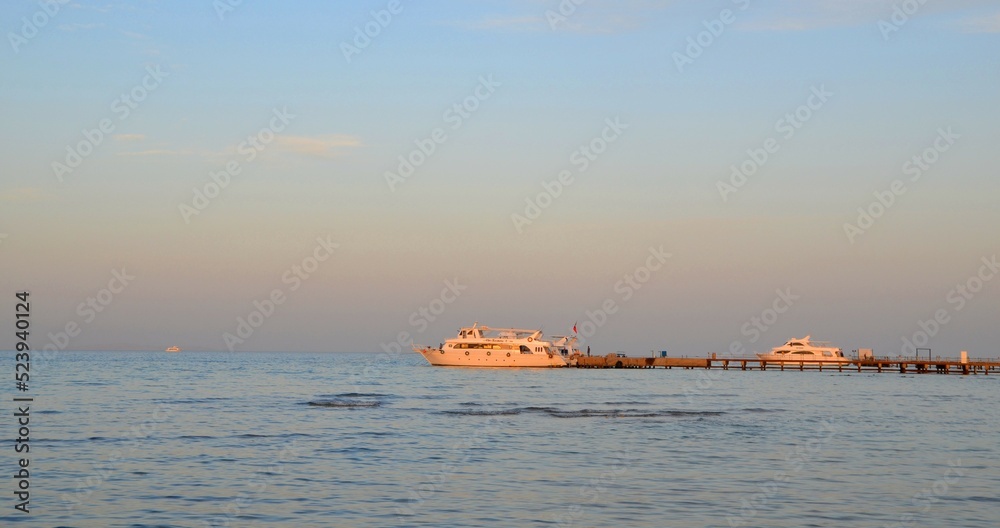 at sunset ships at sea. High quality photo at sunset ships at sea. High quality photo