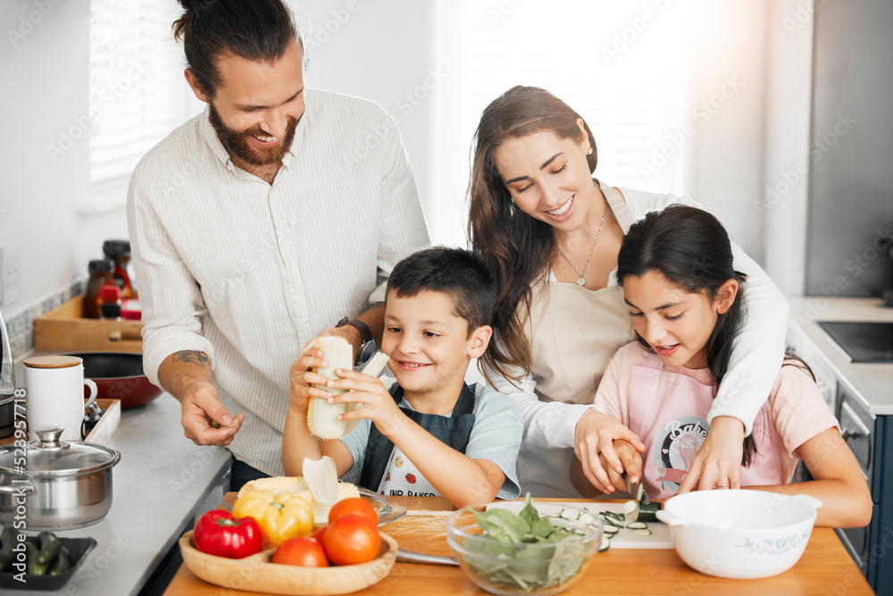 Healthy food, cooking and bonding of family making, preparing and cutting ingredients for meal together in a home kitchen. Happy parents teaching fun kids about fresh, homemade and nutritious eating Healthy food, cooking and bonding of family making, preparing and cutting ingredients for meal together in a home kitchen. Happy parents teaching fun kids about fresh, homemade and nutritious eating