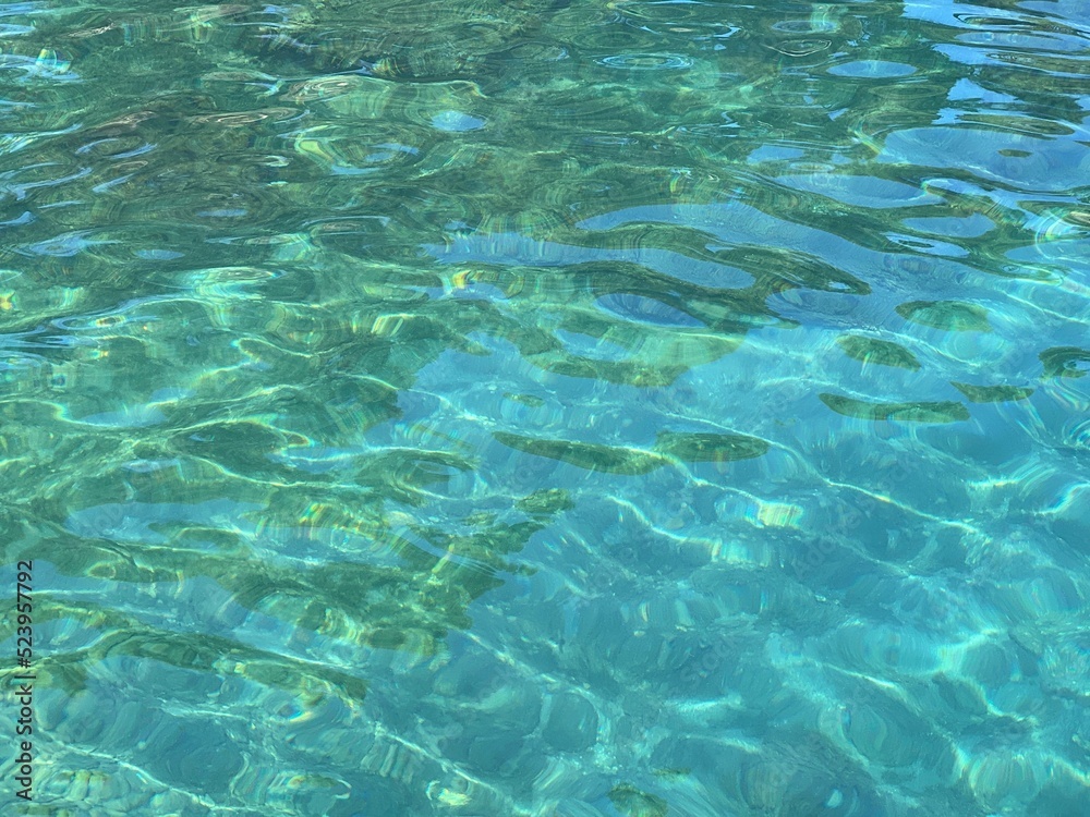 Sea water turquoise blue clear surface. Beautiful aqua seascape.