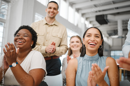 Clapping, celebrating and excited after training presentation, office meeting or education workshop for creative group. Diverse, cheering or motivated colleagues smiling with growth mindset or vision