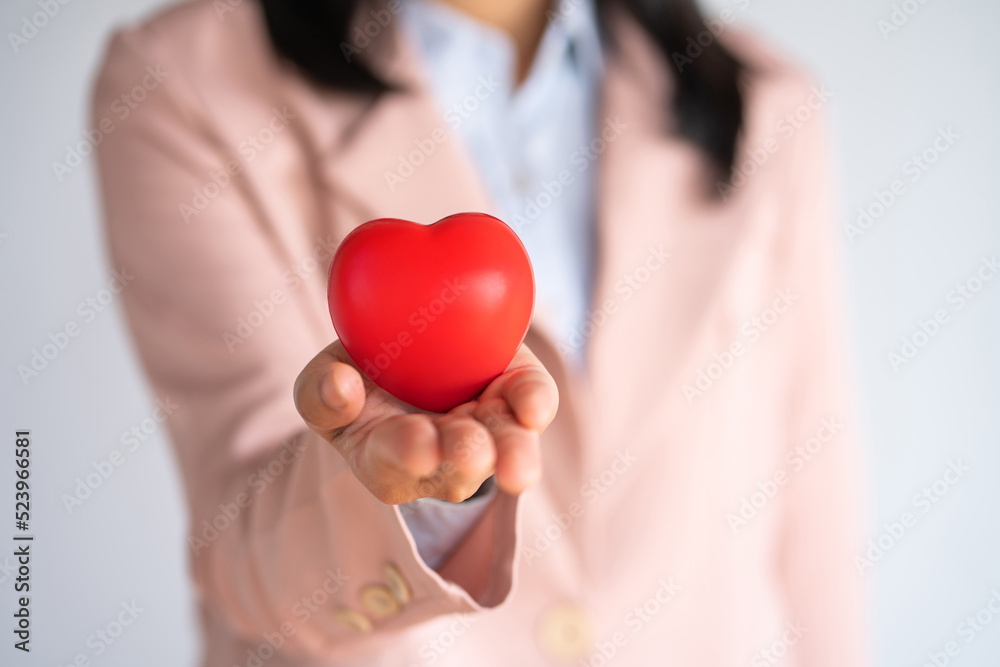 Woman hands holding a red heart, heart health insurance, health care. Woman hands holding a red heart, heart health insurance, health care.