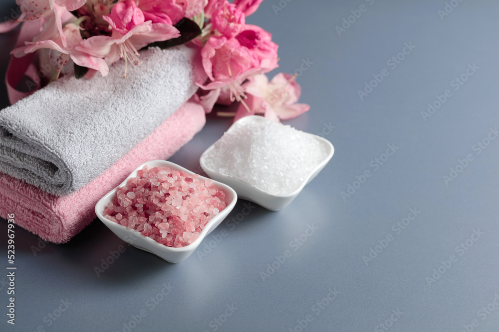 Spa composition with pink and white sea salt.