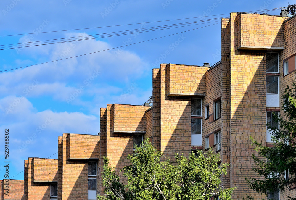 Multi-storey residential building on a summer day Multi-storey residential building on a summer day