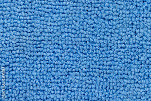 Background, photo of a blue synthetic coating texture, close-up.