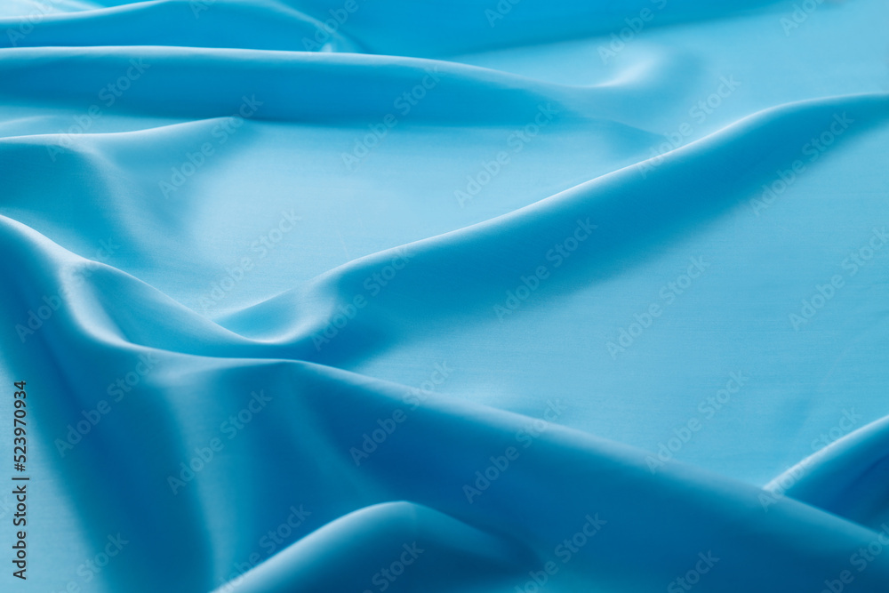 Close up of light blue silk background