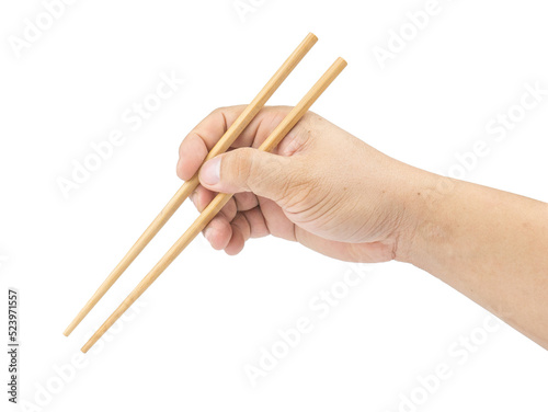 Right asian Hand holding wooden chopsticks isolated on white background.picking or selecting object something