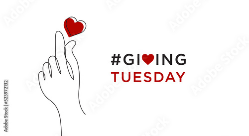Giving Tuesday is a global day of charitable giving after Black Friday shopping day. Charity, give help, donations and support concept with text message sign and red heart in woman hand photo