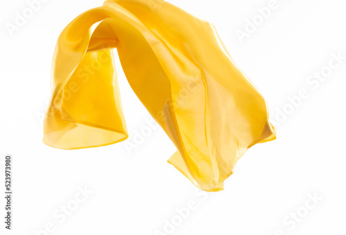 Yellow silk flying on white background