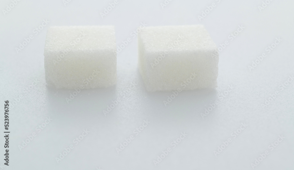Two sugar cubes on white background Two sugar cubes on white background