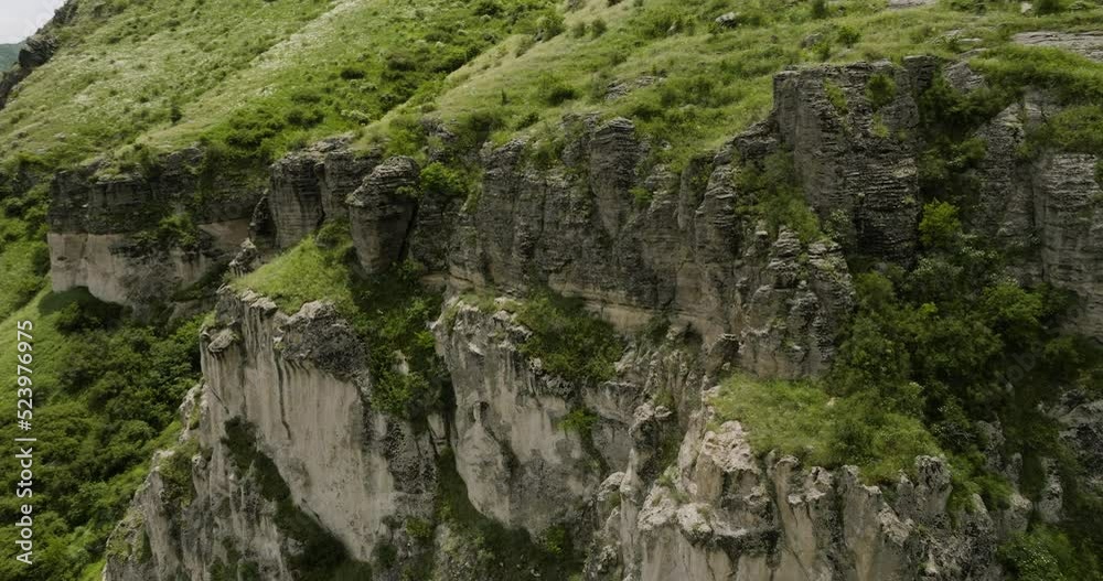 Steep Rugged Cliffs Across The River Near Khertvisi Fortress In Meskheti, Georgia. Aerial Drone Orbit Steep Rugged Cliffs Across The River Near Khertvisi Fortress In Meskheti, Georgia. Aerial Drone Orbit