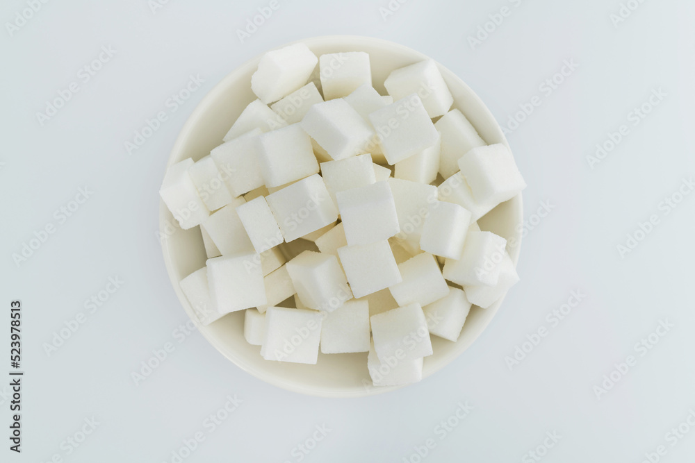 Sugar cubes on a plate on white background Sugar cubes on a plate on white background