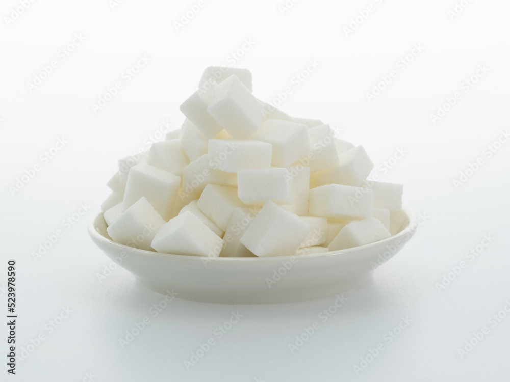 Sugar cubes on a plate on white background Sugar cubes on a plate on white background
