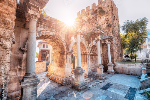 Fototapeta Famous gate or Hadrian arch in Antalya without visitors with sunflare
