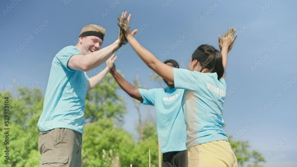 Group of volunteer helpers planting trees in mangrove forest for environmental protection and ecology, reduce global warming. hands up Group of volunteer helpers planting trees in mangrove forest for environmental protection and ecology, reduce global warming. hands up