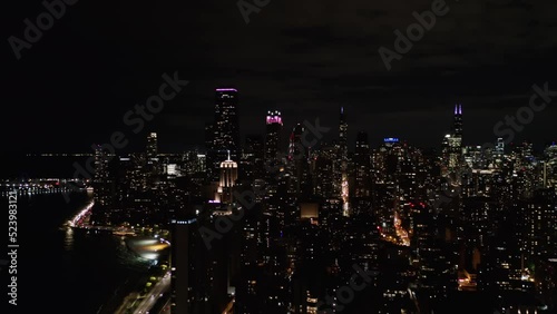 The drone captured the aerial view night lights of the urban city of Chicago, Illinois, USA.