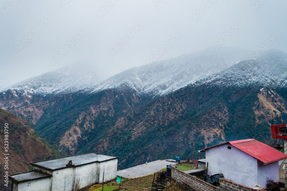 Uttrakhand. India. 23rd Jan2022.A beautiful shot of distant small village in the mountains of Okhimath district of Chamoli 