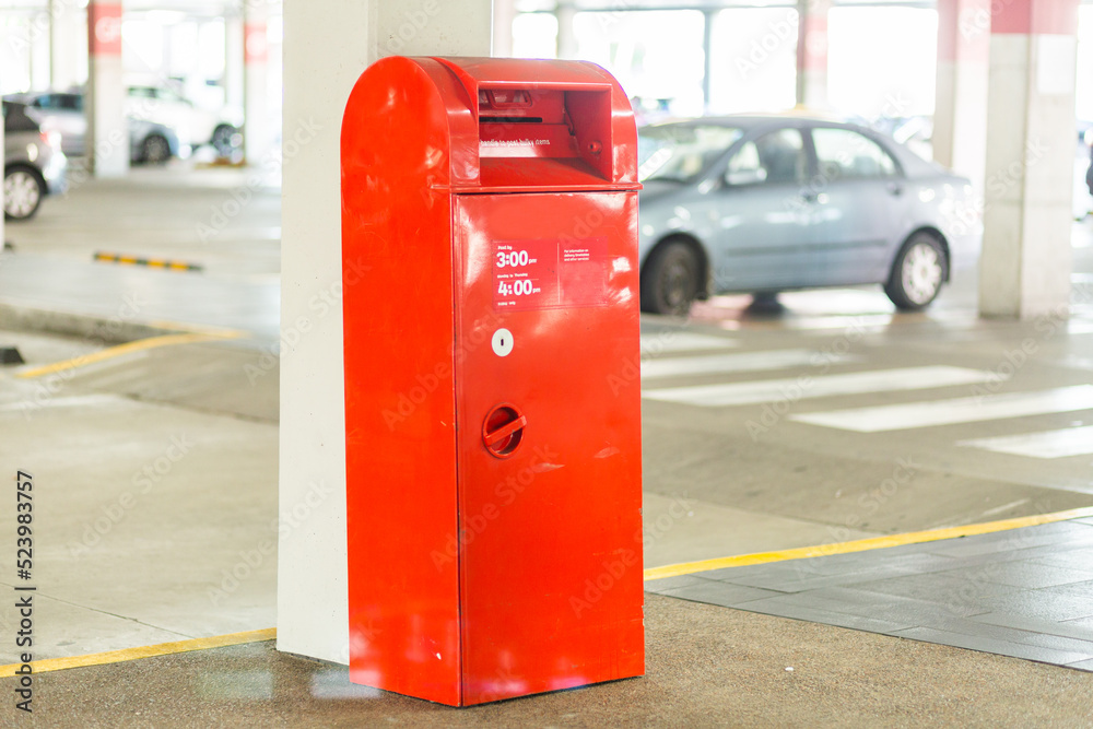 Red post box near shopping center Red post box near shopping center