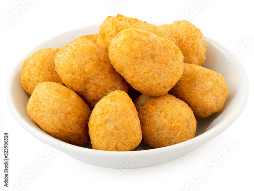 Fried breaded chilli cheese nuggets in a white ceramic bowl isolated on white.