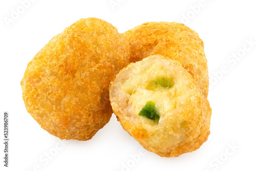 Three fried breaded chilli cheese nuggets isolated on white. One eaten.