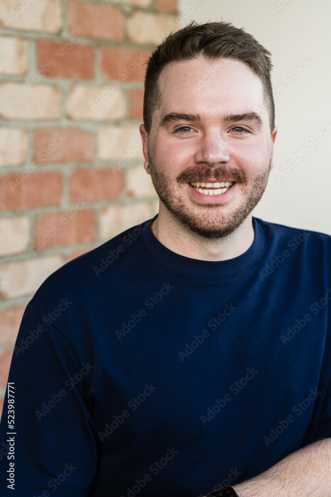 portrait, smiling gay man in his 30s portrait, smiling gay man in his 30s