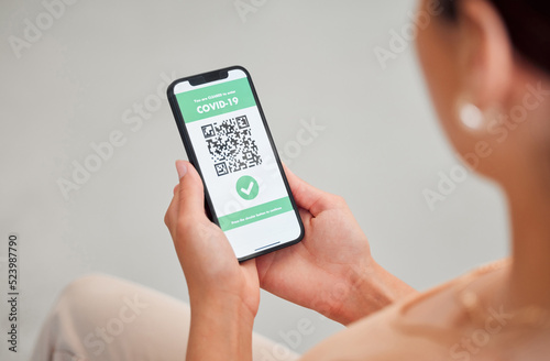 Covid vaccine passport, digital certificate and immunity travel pass displayed with qr code on phone screen for health clearance. Woman, tourist and traveler with mobile app for medical vaccination
